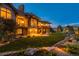 Stunning home exterior at dusk, showcasing landscaping and backyard at 9977 Elkhorn St, Littleton, CO 80127
