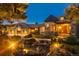 Elegant home with a three-car garage, water feature, and landscaping at 9977 Elkhorn St, Littleton, CO 80127