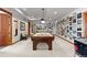 Basement game room with pool table and arcade game at 9977 Elkhorn St, Littleton, CO 80127