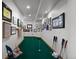 Indoor putting green with golf memorabilia display at 9977 Elkhorn St, Littleton, CO 80127