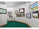 Indoor putting green with framed golf artwork at 9977 Elkhorn St, Littleton, CO 80127