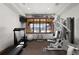 Home gym with treadmill, weight machine, and exercise ball at 9977 Elkhorn St, Littleton, CO 80127