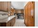 Functional laundry room with washer, dryer, and ample counter space at 9977 Elkhorn St, Littleton, CO 80127