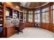 Spacious library with built-in bookshelves, wood finishes, and a view at 9977 Elkhorn St, Littleton, CO 80127