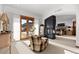 Spacious main bedroom with fireplace, sitting area, and private deck access at 9977 Elkhorn St, Littleton, CO 80127