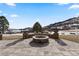 Stone patio with fire pit, offering scenic mountain views at 9977 Elkhorn St, Littleton, CO 80127
