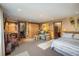 Finished basement features a bedroom area, living area, piano, and a desk at 44 Linn Ln, Golden, CO 80403