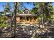 Cozy home with a picturesque landscaped yard, perfect for outdoor gatherings and enjoying nature's beauty at 44 Linn Ln, Golden, CO 80403