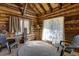 Cozy interior with exposed wood beams, natural light, and casual seating at 44 Linn Ln, Golden, CO 80403