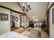 Bedroom with hardwood floors, skylight, chandelier, and sitting area with chair and desk at 44 Linn Ln, Golden, CO 80403