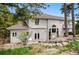 The backyard of this home provides a serene retreat surrounded by lush greenery and mature trees at 19640 Four Winds Way, Monument, CO 80132