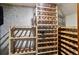 Basement wine storage and room with storage racks for wine bottles and TV at 19640 Four Winds Way, Monument, CO 80132