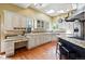 Spacious kitchen with skylights, island with seating and lots of storage at 19640 Four Winds Way, Monument, CO 80132