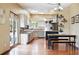 Bright kitchen features skylights, wooden floors, stainless appliances and center island at 19640 Four Winds Way, Monument, CO 80132