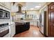 Spacious kitchen features stainless steel appliances, ample cabinet space, and a large island at 19640 Four Winds Way, Monument, CO 80132