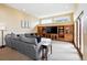 Comfortable living room with a gray couch and a built-in wooden media center at 19640 Four Winds Way, Monument, CO 80132