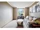 Cozy living room with a comfortable sofa, ottoman, desk, and natural light from the window at 19640 Four Winds Way, Monument, CO 80132