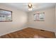 Spacious bedroom featuring hardwood floors and two large windows at 3075 N Elm Ave, Denver, CO 80207