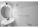 Bright bathroom featuring pedestal sink, a large mirror, and modern fixtures at 9590 E Florida Ave # 1025, Denver, CO 80247