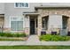 Charming townhome with a stone facade, well-maintained landscaping, and inviting entrance; a great curb appeal at 9590 E Florida Ave # 1025, Denver, CO 80247