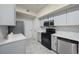 Updated kitchen features stainless steel appliances and plenty of cabinet space at 9590 E Florida Ave # 1025, Denver, CO 80247