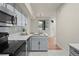 Modern kitchen featuring stainless steel appliances, breakfast bar, and ample counter space at 9590 E Florida Ave # 1025, Denver, CO 80247