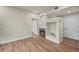 Living room featuring a fireplace with decorative mantle and wood-look flooring at 9590 E Florida Ave # 1025, Denver, CO 80247
