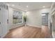 Bright living room features wood floors, a large window, and an open floor plan at 9590 E Florida Ave # 1025, Denver, CO 80247