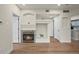 Living room view with a fireplace, mantel, and open doorway to other rooms at 9590 E Florida Ave # 1025, Denver, CO 80247