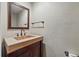 Elegant powder room featuring a unique sink and vanity with updated fixtures at 4468 S Zenobia St, Denver, CO 80236