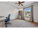 Cozy bedroom featuring neutral carpet, a window letting in natural light, and built-in shelving at 4468 S Zenobia St, Denver, CO 80236