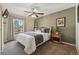 Bedroom with ceiling fan, neutral walls, and a window that lets in natural light at 4468 S Zenobia St, Denver, CO 80236