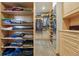 Walk-in closet with custom wood shelving and drawers to maximize storage space at 4468 S Zenobia St, Denver, CO 80236