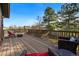 Outdoor deck with patio furniture and railing overlooking the landscaped yard at 4468 S Zenobia St, Denver, CO 80236