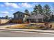 Attractive home with a two-car garage, complemented by a stone-accented front yard, showcasing curb appeal at 4468 S Zenobia St, Denver, CO 80236