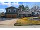 Charming two-story home featuring a well-manicured lawn and a two-car garage, located in a desirable neighborhood at 4468 S Zenobia St, Denver, CO 80236