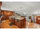 Spacious kitchen with custom wood cabinetry, granite countertops, and modern appliances, perfect for cooking and entertaining at 4468 S Zenobia St, Denver, CO 80236