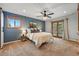 Serene main bedroom with natural light, plush carpet, and a private outdoor balcony at 4468 S Zenobia St, Denver, CO 80236