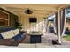 Covered patio featuring comfortable outdoor seating, ceiling fan, and outdoor television at 4468 S Zenobia St, Denver, CO 80236