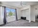 Bedroom features a large window with neutral carpet and an adjacent closet for organized storage at 1655 S Buckley Cir, Aurora, CO 80017