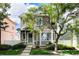 Charming two-story home with a well-maintained lawn, sidewalk, and lush landscaping at 1655 S Buckley Cir, Aurora, CO 80017