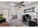 Office area with desk, exercise bike, overhead fan and natural light at 1655 S Buckley Cir, Aurora, CO 80017