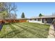 Spacious backyard with a lush lawn and a well-maintained wooden fence at 5780 W 5Th Ave, Lakewood, CO 80226