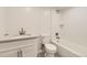 Updated bathroom with marble top vanity, white subway tile, and hex tile floor at 5780 W 5Th Ave, Lakewood, CO 80226