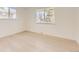 Bedroom with hardwood flooring and natural light from the window at 5780 W 5Th Ave, Lakewood, CO 80226