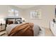 Inviting bedroom with plush bedding, ample natural light, and stylish decor at 5780 W 5Th Ave, Lakewood, CO 80226