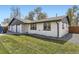 Well-maintained home with a lush green lawn and updated exterior paint at 5780 W 5Th Ave, Lakewood, CO 80226
