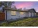 Nice home with white brick, manicured lawn, and a great sunset backdrop at 5780 W 5Th Ave, Lakewood, CO 80226