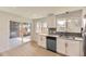 Bright kitchen with stainless steel appliances and a convenient sliding door to the patio at 5780 W 5Th Ave, Lakewood, CO 80226