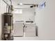 Bright laundry room with washer, dryer, and water heater, plus plenty of storage at 5780 W 5Th Ave, Lakewood, CO 80226